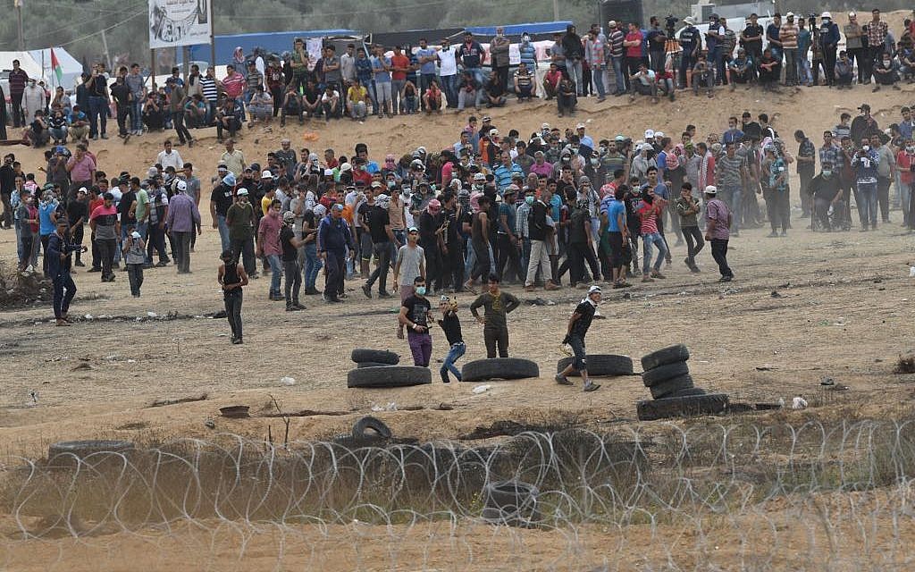 Illustrative: Thousands of Palestinians protest along the Gaza border with Israel, in the sixth 'March of Return' demonstration on May 4, 2018. (Israel Defense Forces)