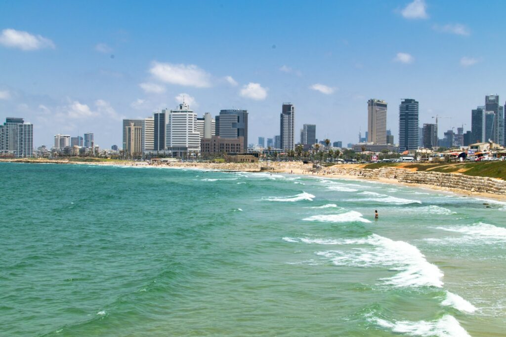 high rise buildings near sea during daytime