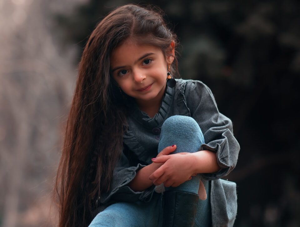 girl sitting on rock