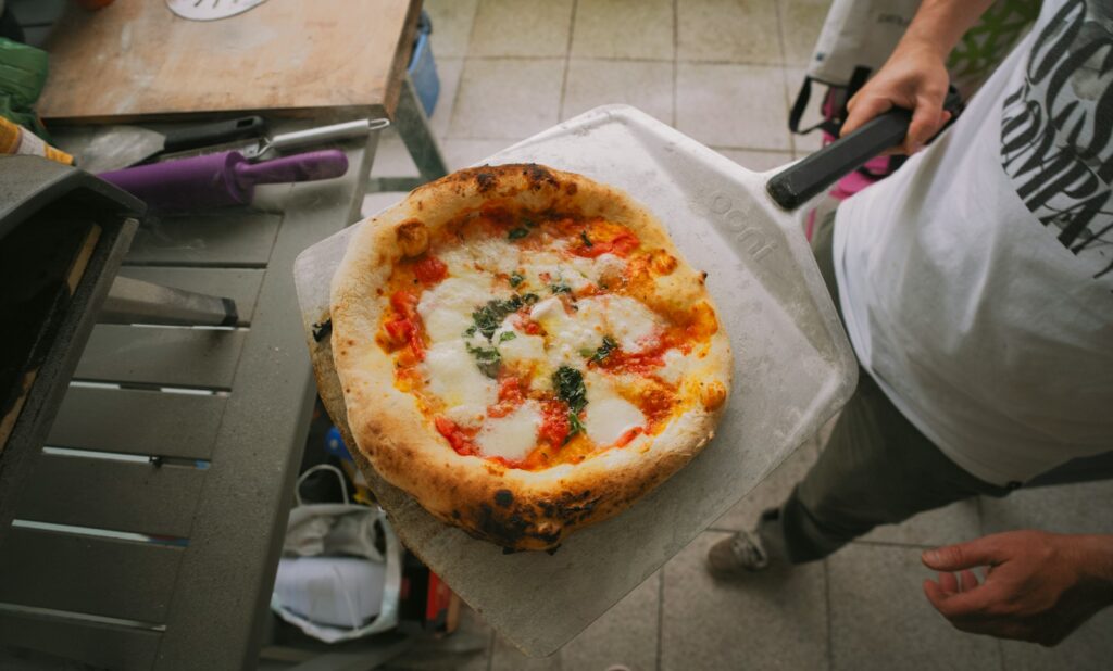 a pizza sitting on top of a piece of paper