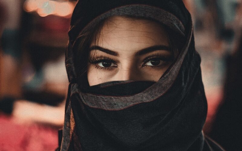 woman in black hijab standing