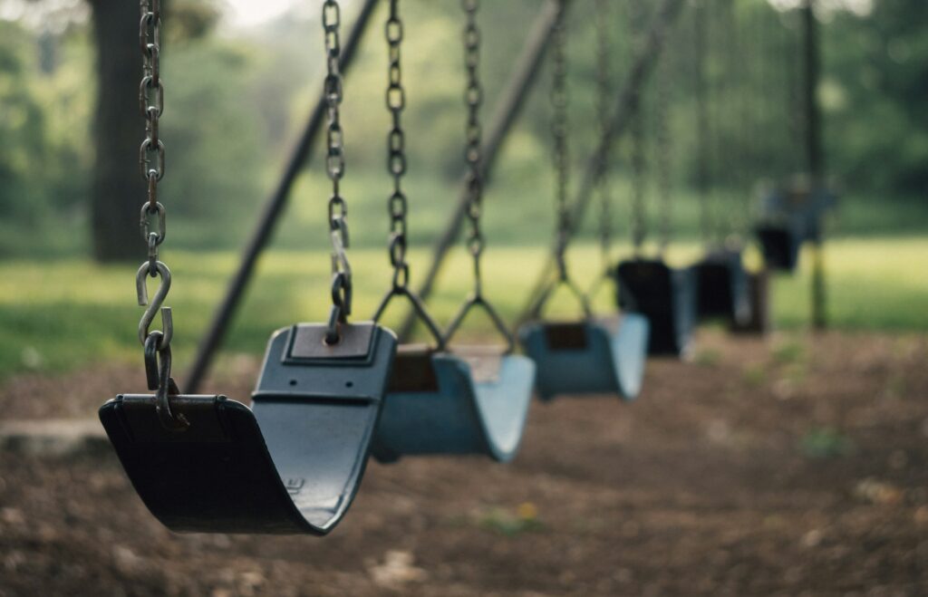 selective focus shot of outdoor swing