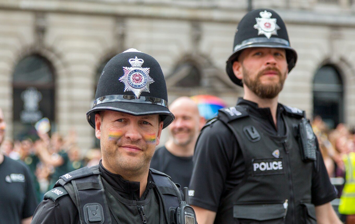 man in black police uniform wearing black helmet