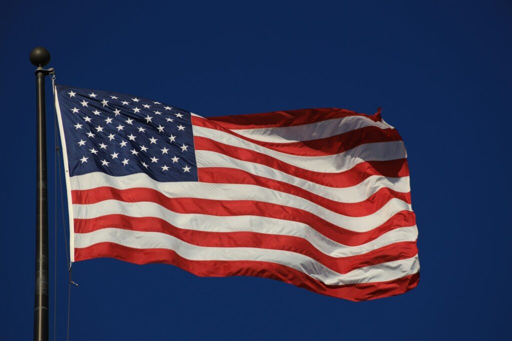 An american flag waving in the wind